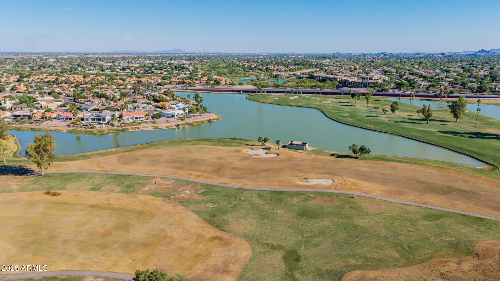 7615 East Tucson Road Scottsdale, AZ 85258 - Photo 50 of 54 an aerial view of a houses with a lake view