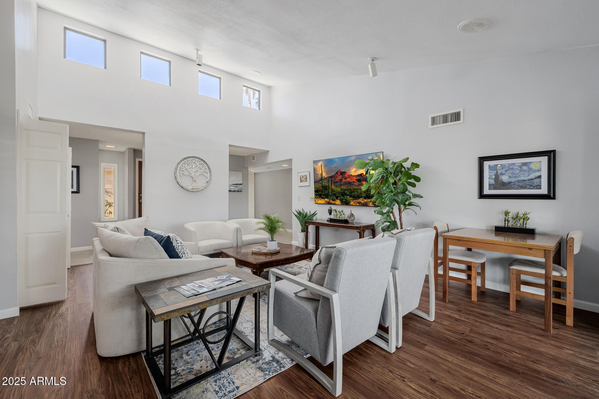 7615 East Tucson Road Scottsdale, AZ 85258 - Photo 8 of 54 a living room with furniture and a flat screen tv