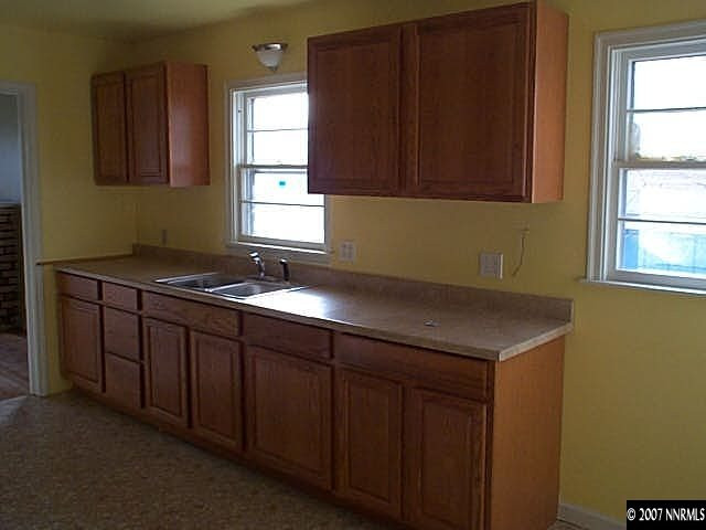 1945 Wilder Street Reno, NV 89512 - Photo 3 of 9 a kitchen with a sink and cabinets