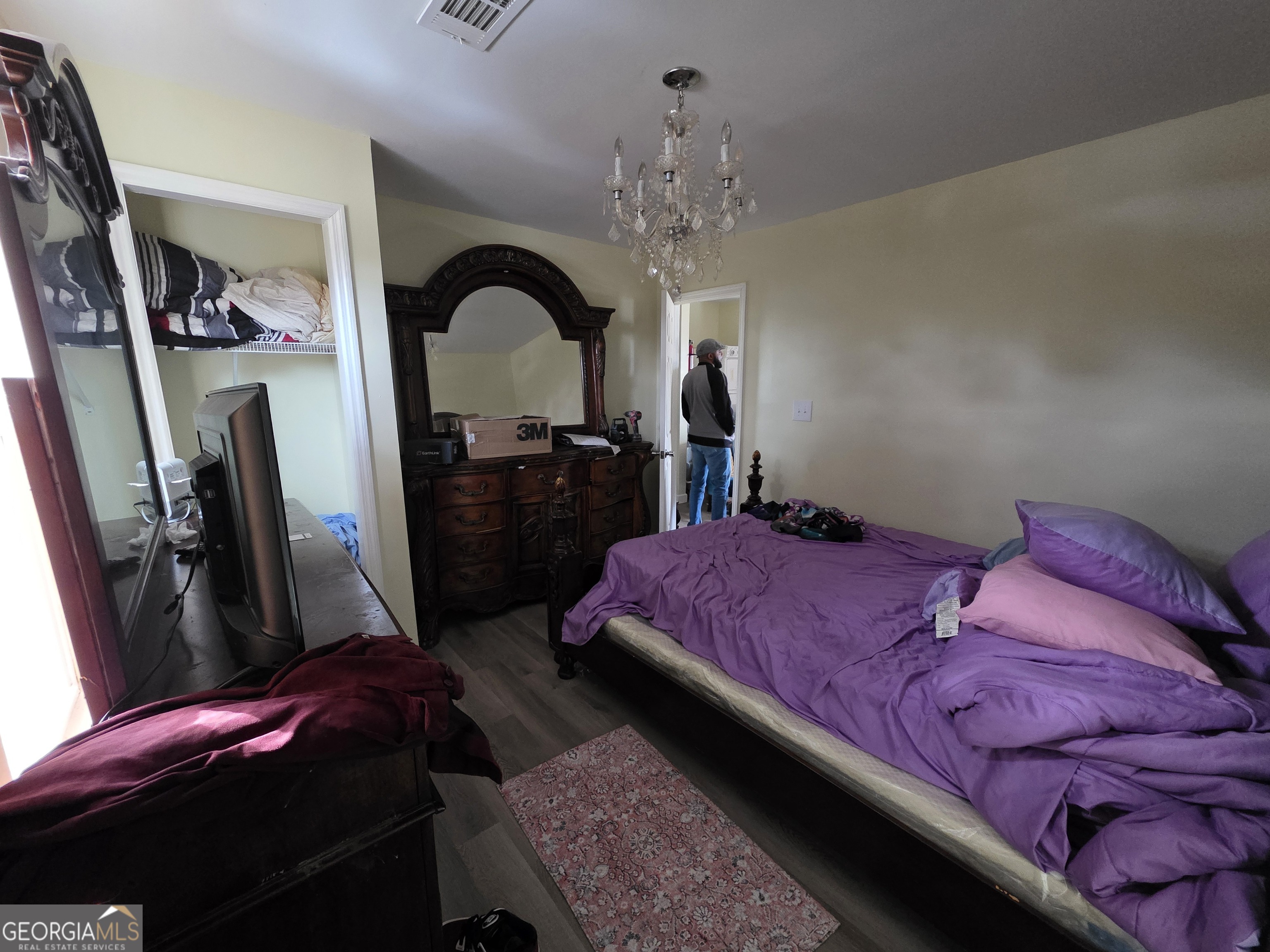 403 Vienna Street Fort Valley, GA 31030 - Photo 5 of 10 a bedroom with a bed and a large mirror on the dresser