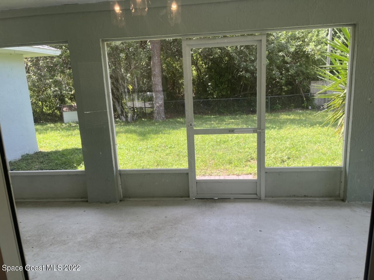 544 Plumbago Road Northwest Palm Bay, FL 32907 - Photo 15 of 16 a view of an empty room with a window