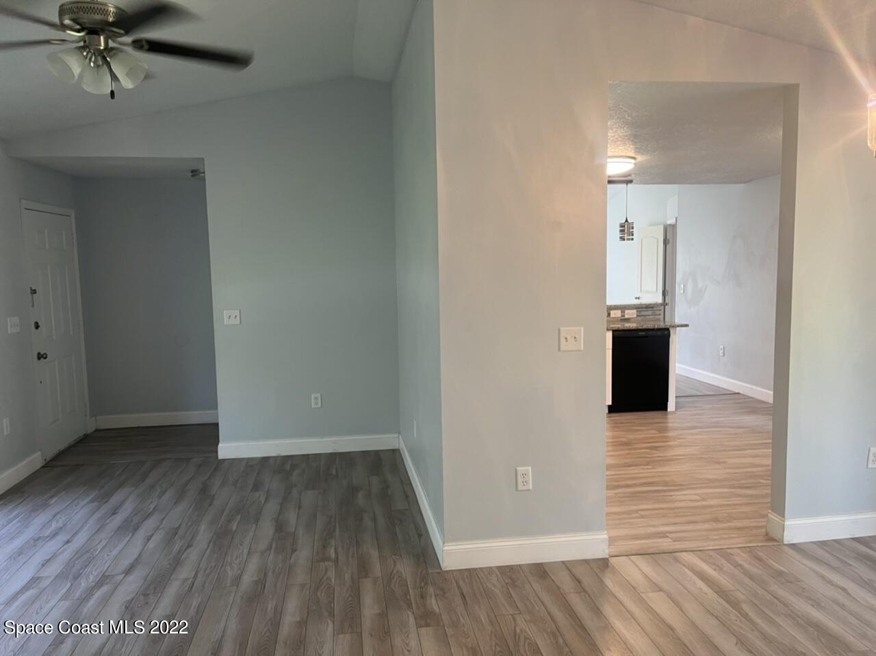 544 Plumbago Road Northwest Palm Bay, FL 32907 - Photo 3 of 16 a view of a livingroom with wooden floor