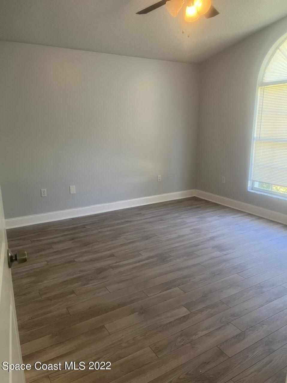 544 Plumbago Road Northwest Palm Bay, FL 32907 - Photo 9 of 16 a view of an empty room and window