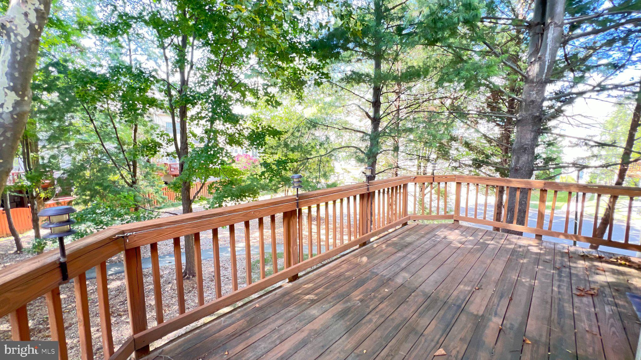 4100 Flower Fairfax, VA 22030 - Photo 41 of 47 a balcony with wooden floor and trees