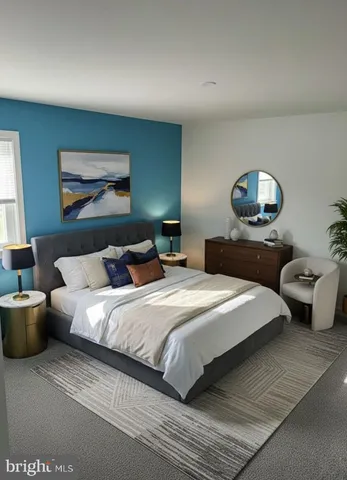 a bedroom with bed and a chandelier