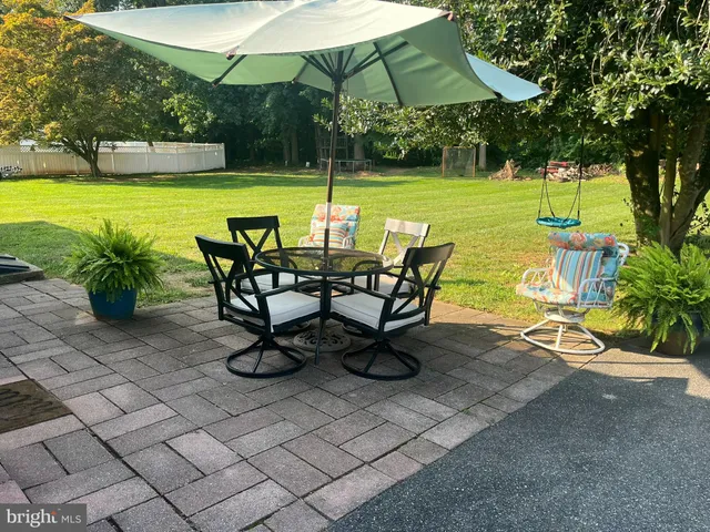 a view of a swimming pool and lounge chairs