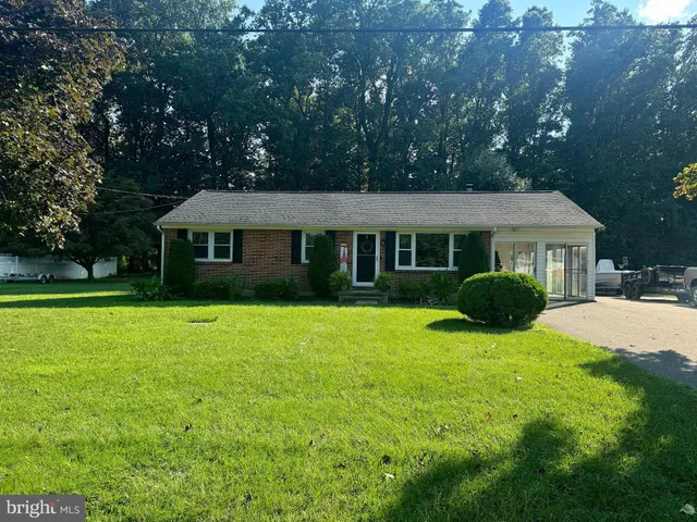 a view of house with a garden