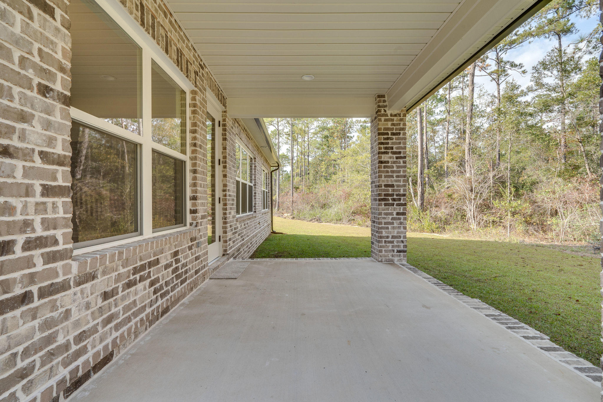 105 Creve Core Drive Crestview, FL 32539 - Photo 1 of 14 a view of porch and garden