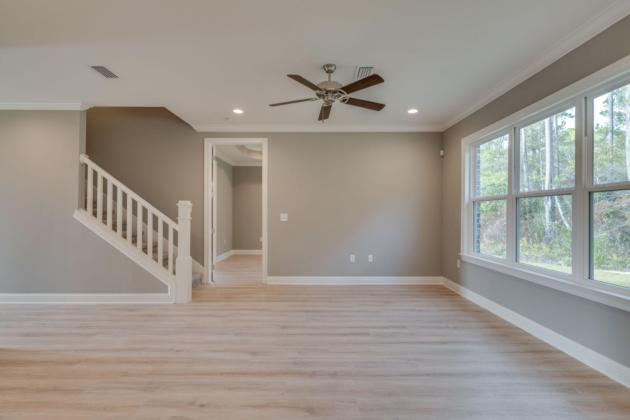 105 Creve Core Drive Crestview, FL 32539 - Photo 14 of 14 wooden floor in an empty room with a window