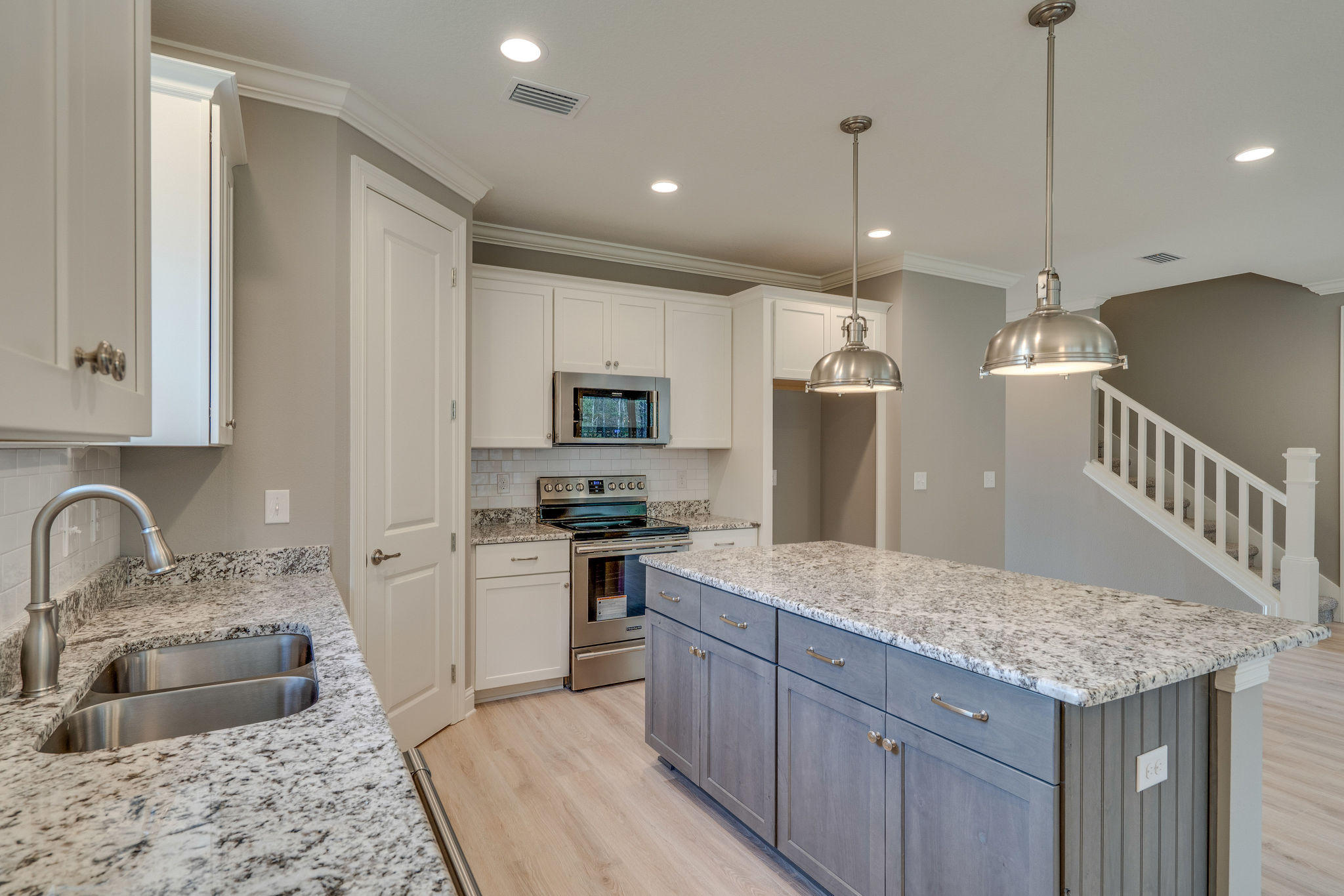 105 Creve Core Drive Crestview, FL 32539 - Photo 4 of 14 a kitchen with stainless steel appliances granite countertop a sink stove and refrigerator