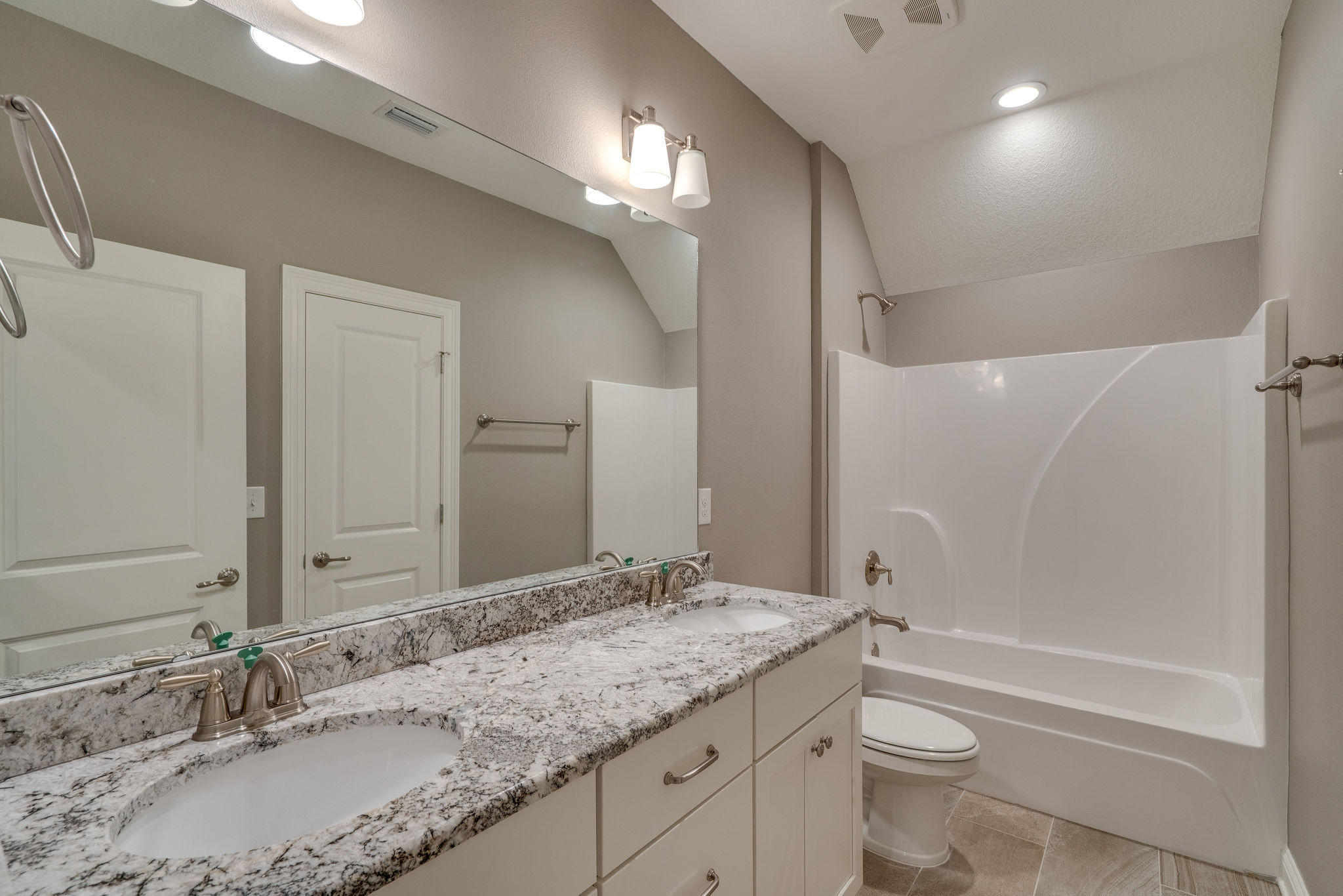 105 Creve Core Drive Crestview, FL 32539 - Photo 6 of 14 a bathroom with a granite countertop sink a toilet and bathtub
