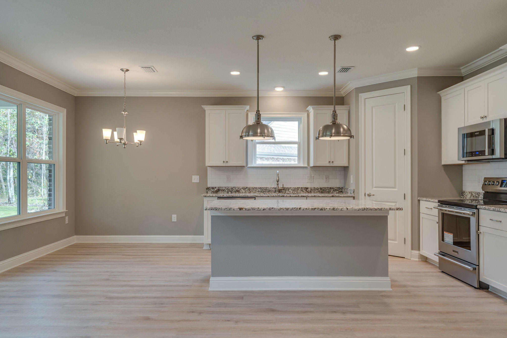 105 Creve Core Drive Crestview, FL 32539 - Photo 8 of 14 a view of a kitchen cabinets and a wooden floor