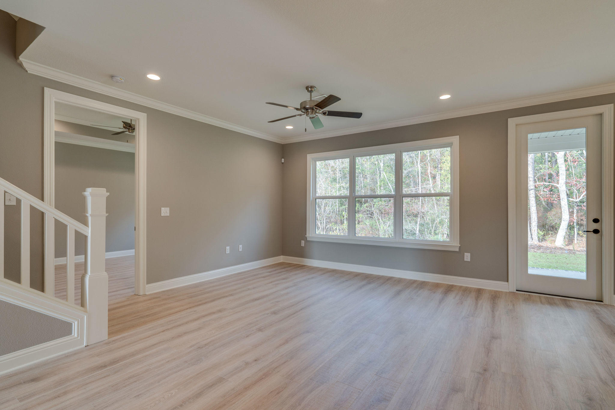 105 Creve Core Drive Crestview, FL 32539 - Photo 9 of 14 wooden floor in an empty room with a window
