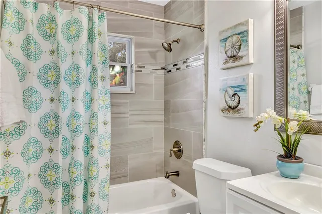 a bathroom with a shower and a toilet