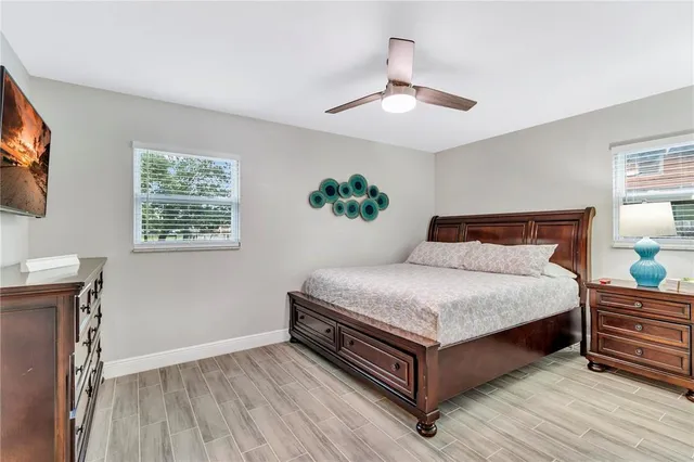 a bedroom with a bed and window