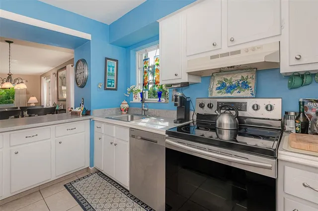 a kitchen with cabinets appliances and a counter top