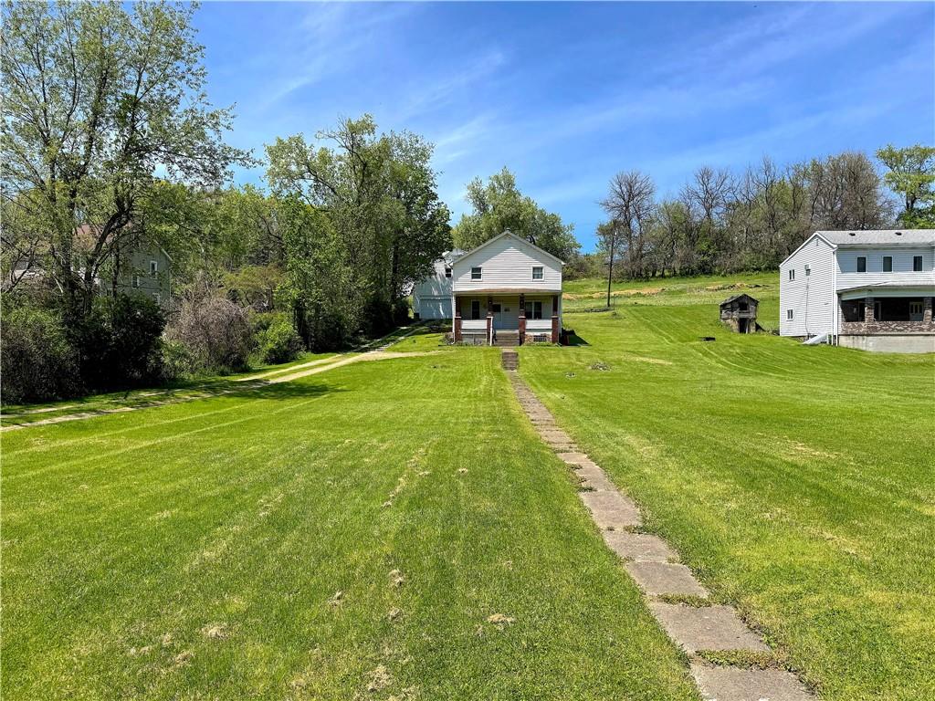 3003 Riverside Drive Claridge, PA 15623 - Photo 7 of 28 a backyard of a house with table and chairs