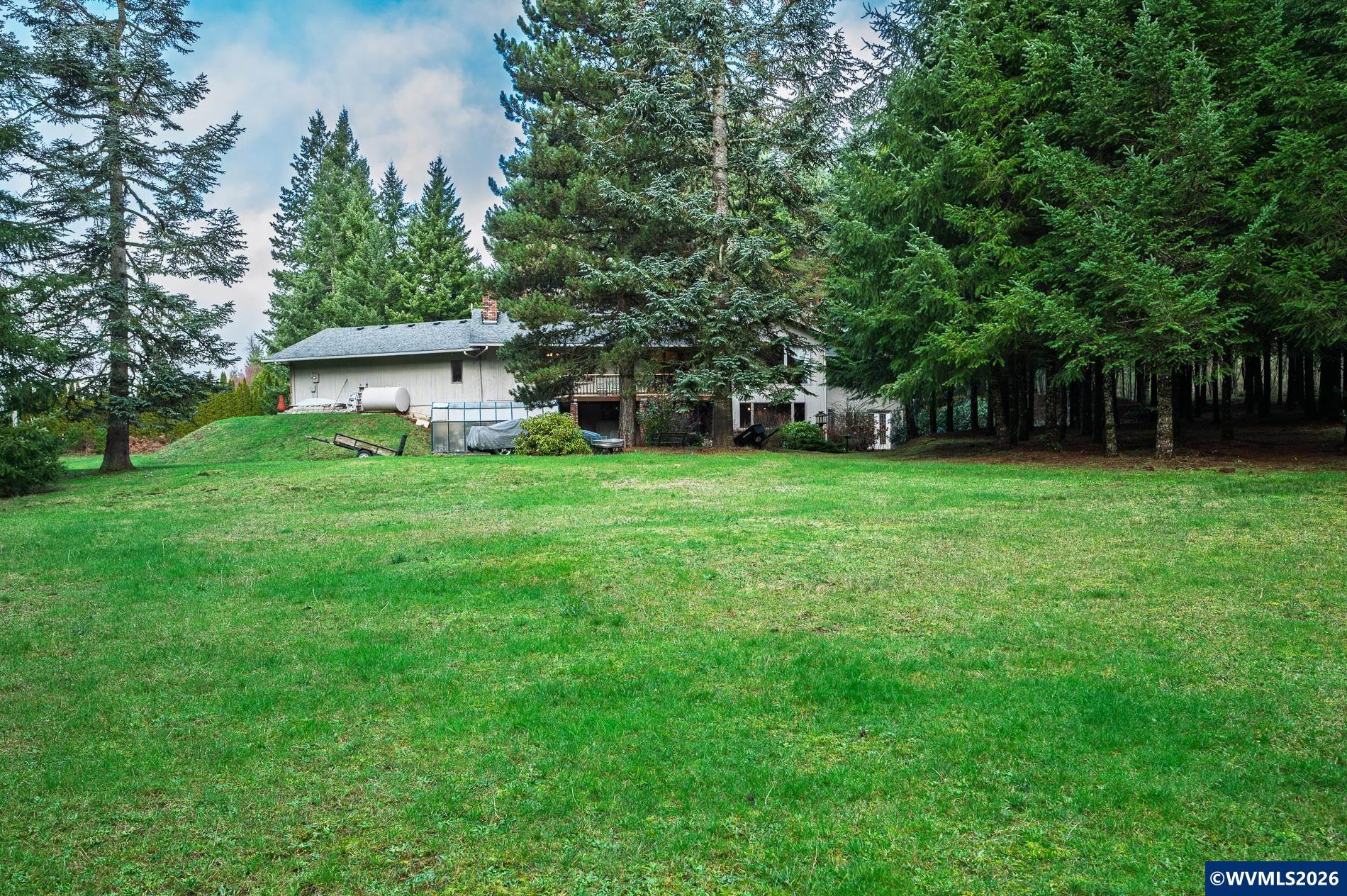 27572 South Kinzy Road Estacada, OR 97023 - Photo 46 of 50 a view of a tree in front of a house