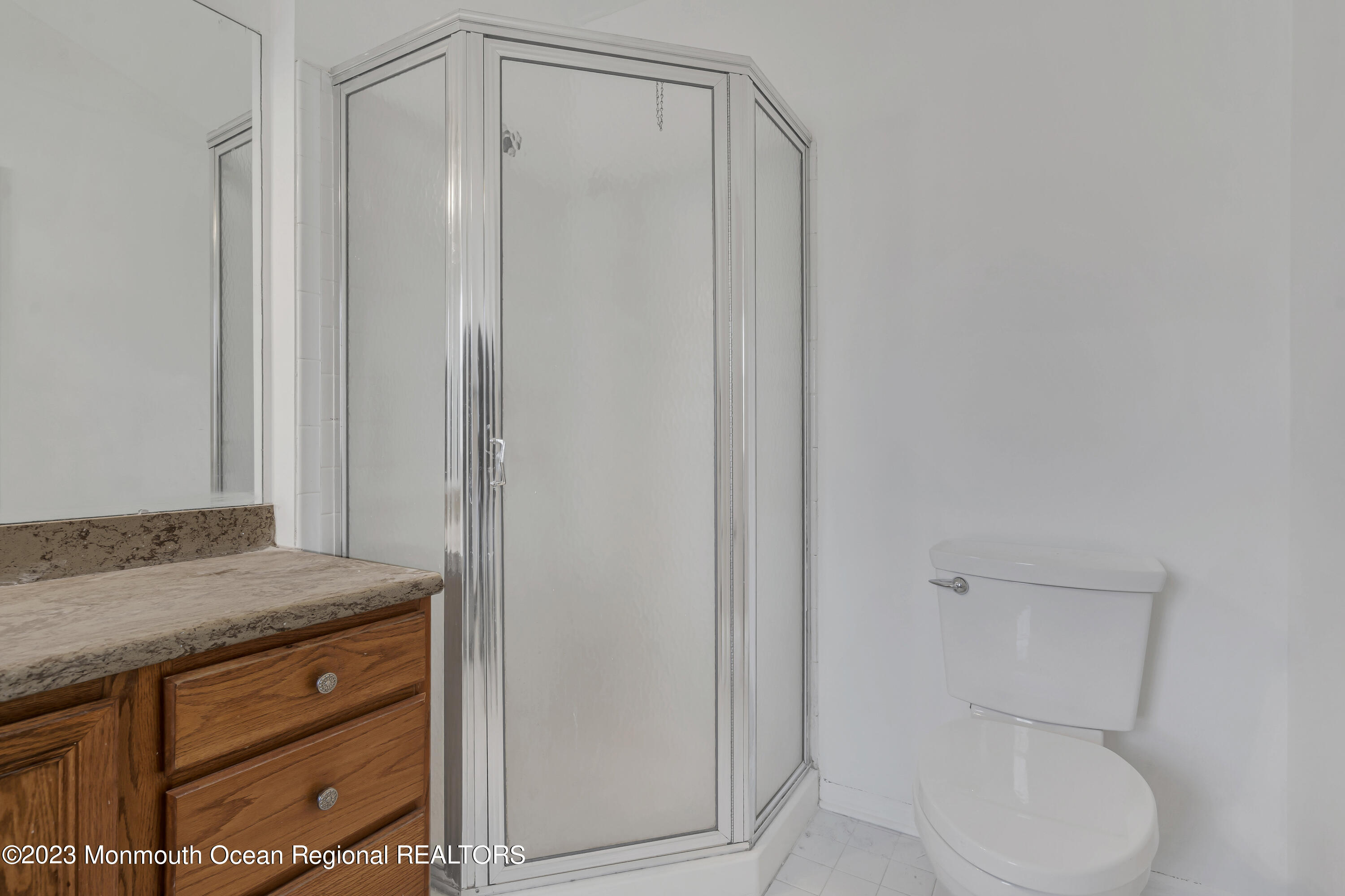 796 Harmony Road Jackson, NJ 08527 - Photo 16 of 22 a bathroom with a toilet a sink and vanity