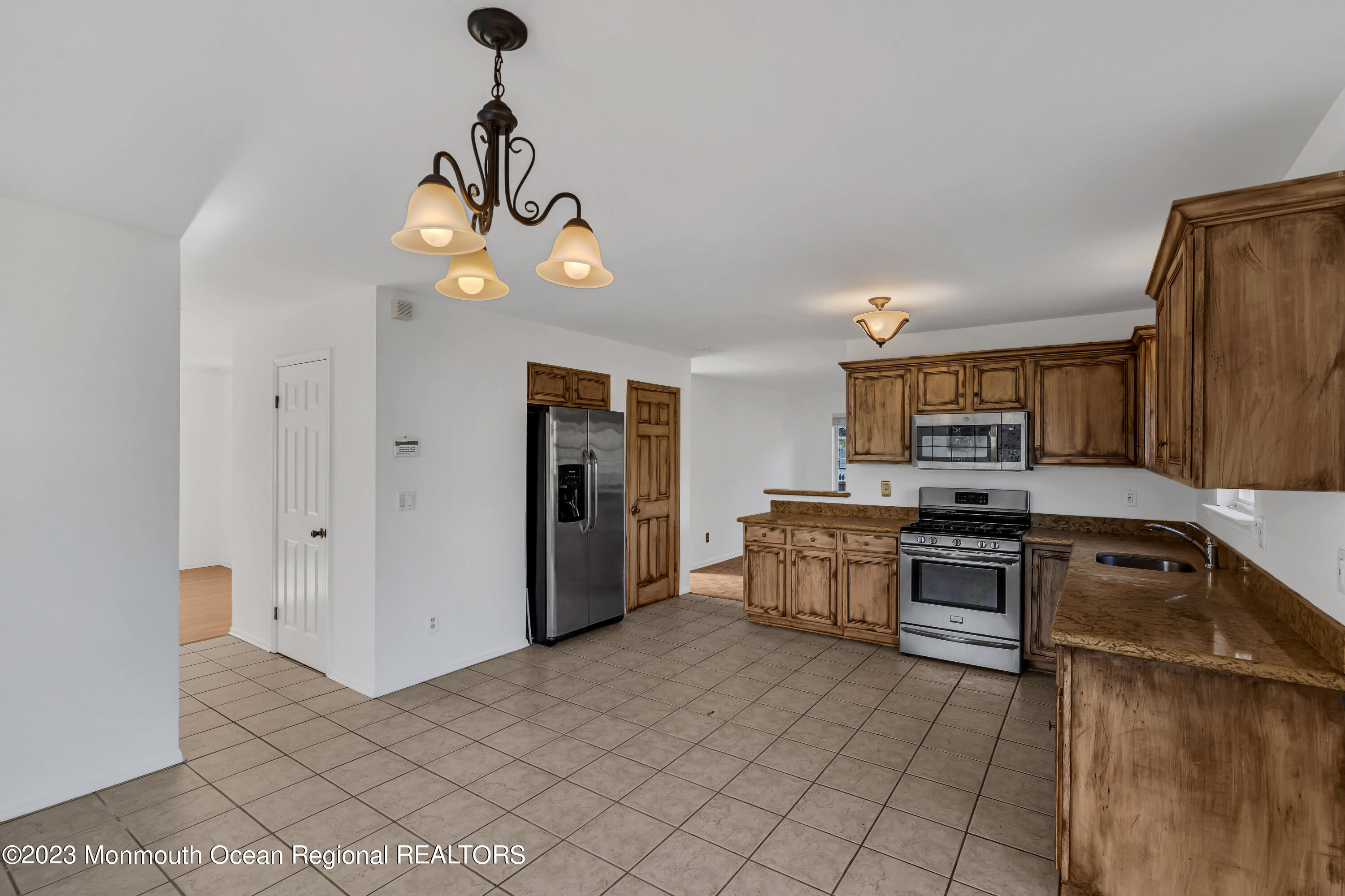 796 Harmony Road Jackson, NJ 08527 - Photo 9 of 22 a kitchen with stainless steel appliances granite countertop a sink and cabinets