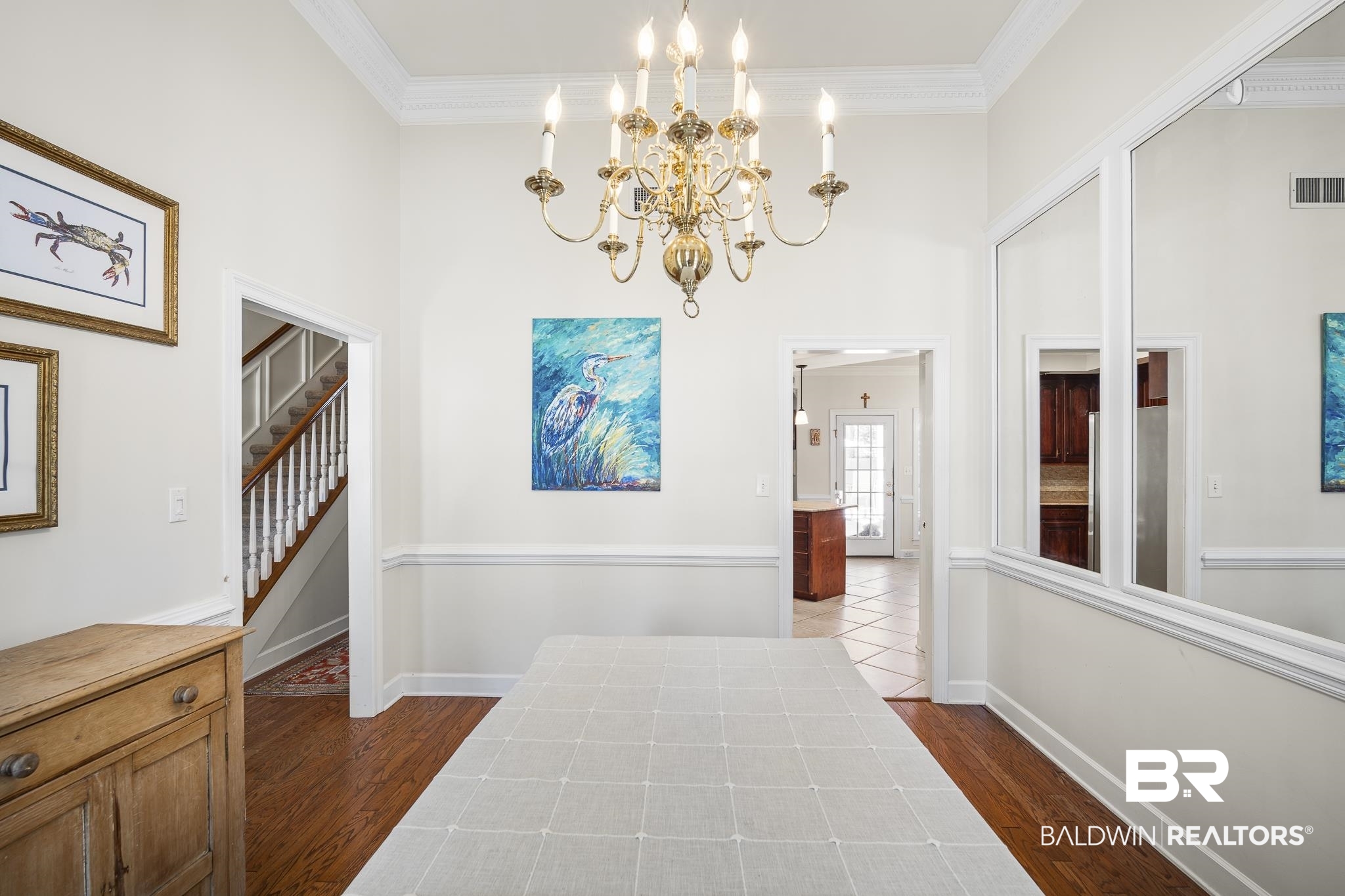 402 Potters Mills Road Daphne, AL 36526 - Photo 6 of 45 Corridor featuring a chandelier, dark wood-style flooring, a towering ceiling, crown molding, and baseboards