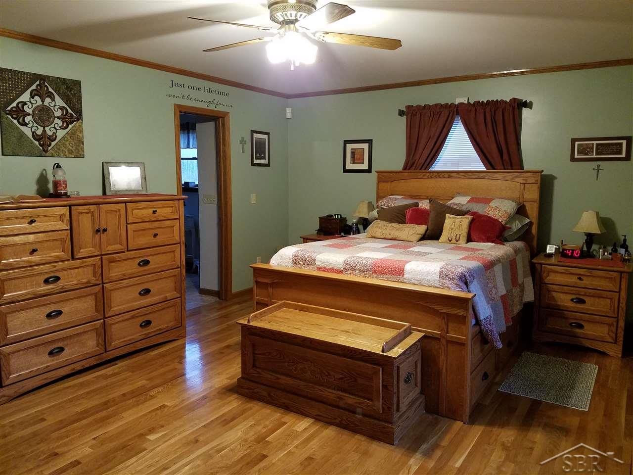 4580 West Gary Road Chesaning, MI 48616 - Photo 27 of 32 Private on suite, walk in closet, hardwood floors.