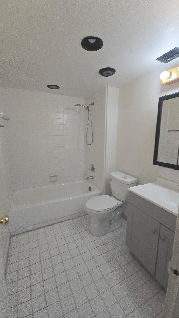 8040 North Colony Circle, Unit 102 Tamarac, FL 33321 - Photo 13 of 17 a bathroom with a sink a toilet and shower