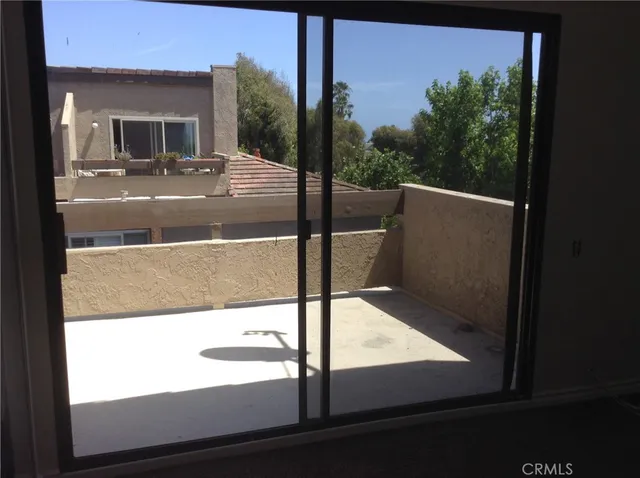 a view of swimming pool with outdoor seating and plants
