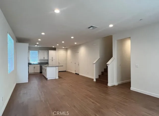 a view of kitchen and refrigerator in a room