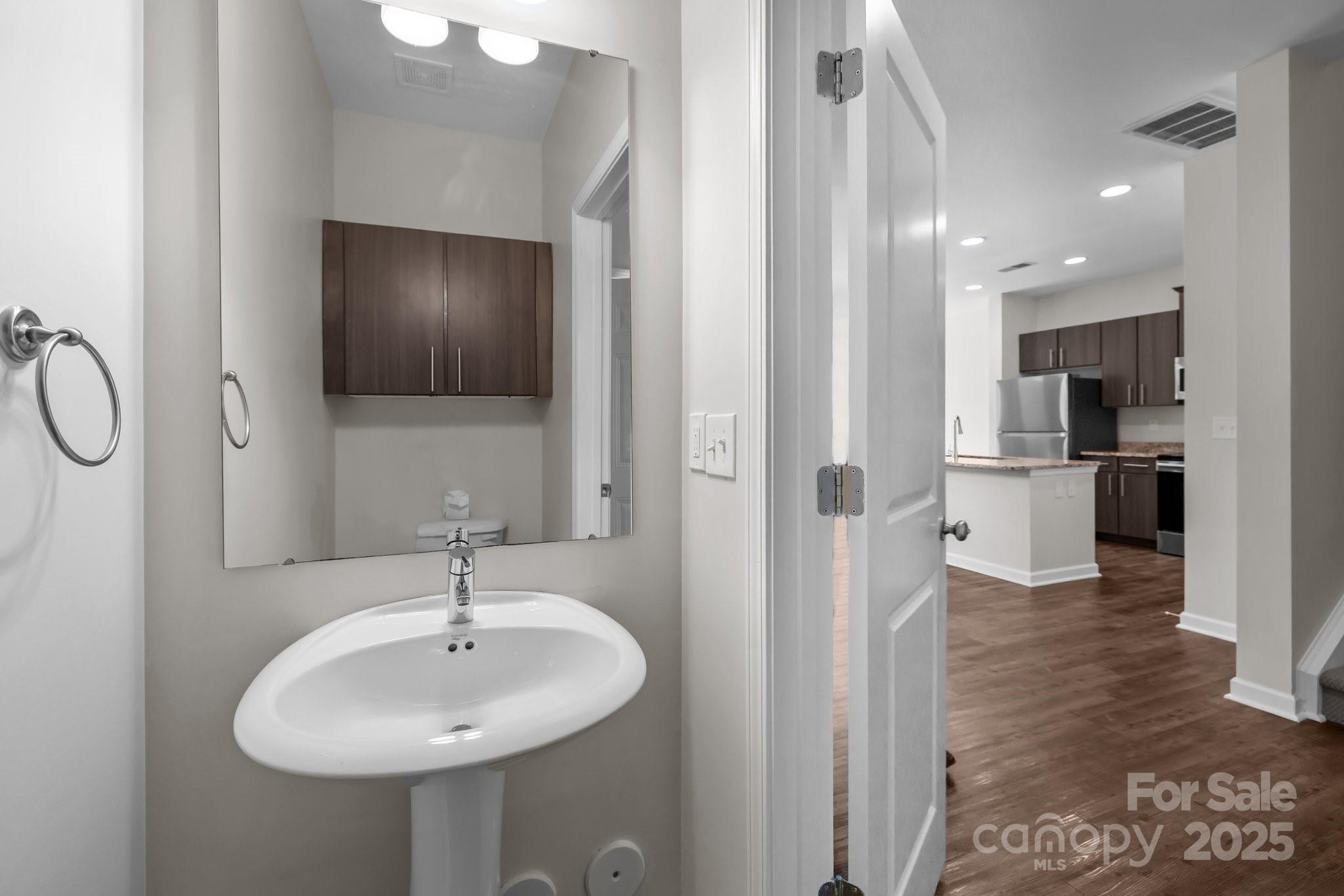 206 Overstone Court Fort Mill, SC 29715 - Photo 17 of 47 a bathroom with a sink and a mirror
