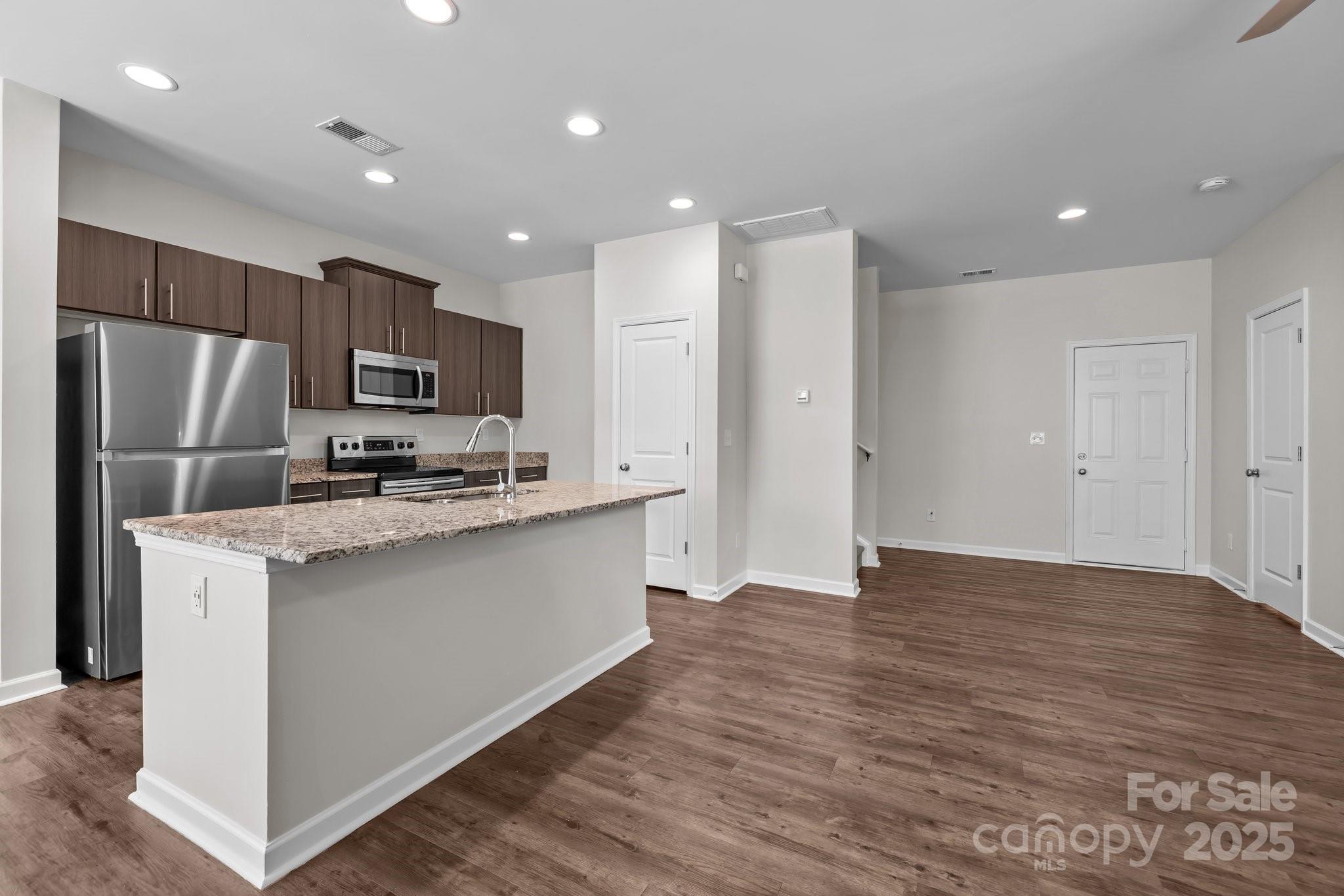 206 Overstone Court Fort Mill, SC 29715 - Photo 19 of 47 a kitchen with stainless steel appliances a refrigerator sink and microwave