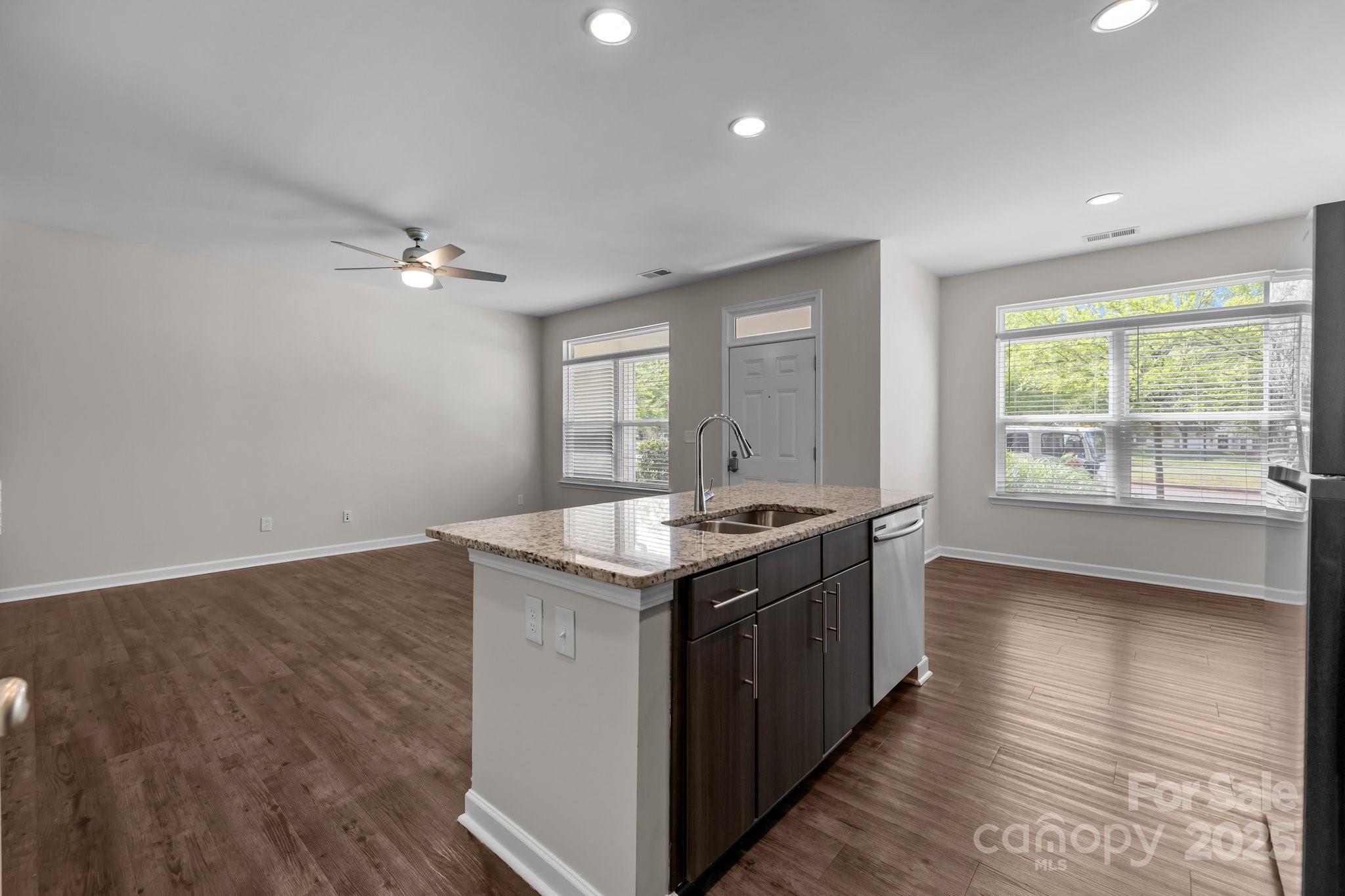 206 Overstone Court Fort Mill, SC 29715 - Photo 23 of 47 a kitchen with granite countertop a stove and a sink