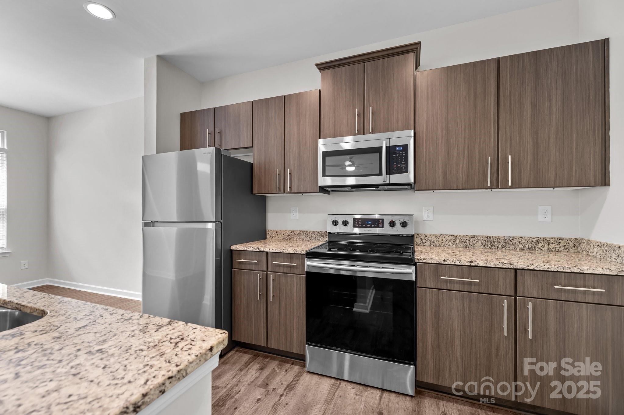 206 Overstone Court Fort Mill, SC 29715 - Photo 24 of 47 a kitchen with a stove microwave and refrigerator