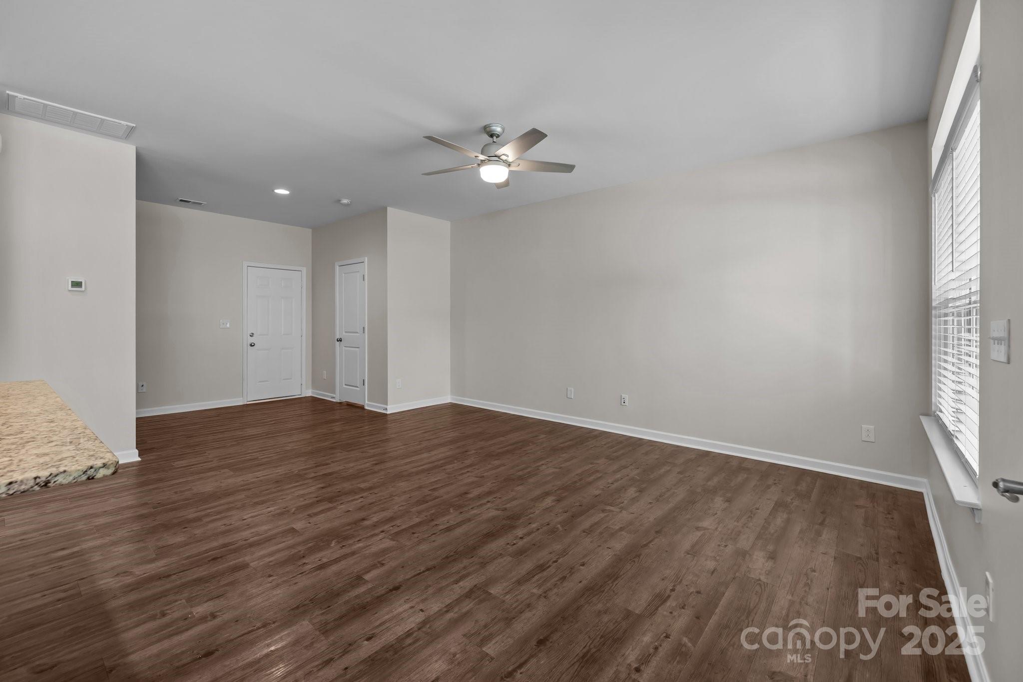 206 Overstone Court Fort Mill, SC 29715 - Photo 26 of 47 wooden floor in an empty room with a window