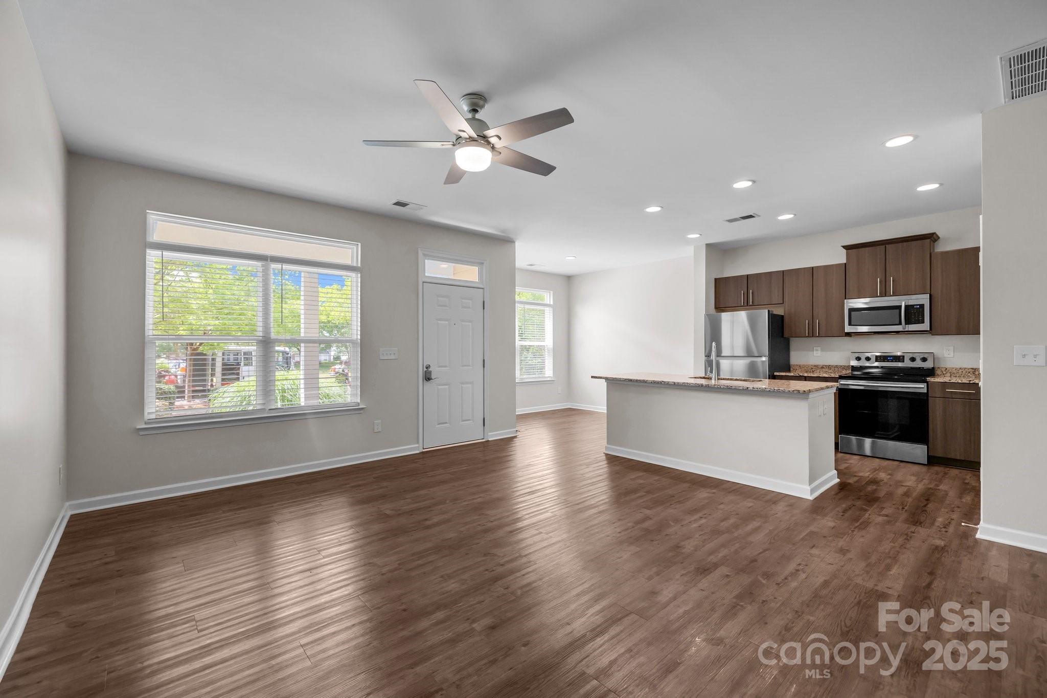 206 Overstone Court Fort Mill, SC 29715 - Photo 27 of 47 a view of kitchen with sink and wooden floor