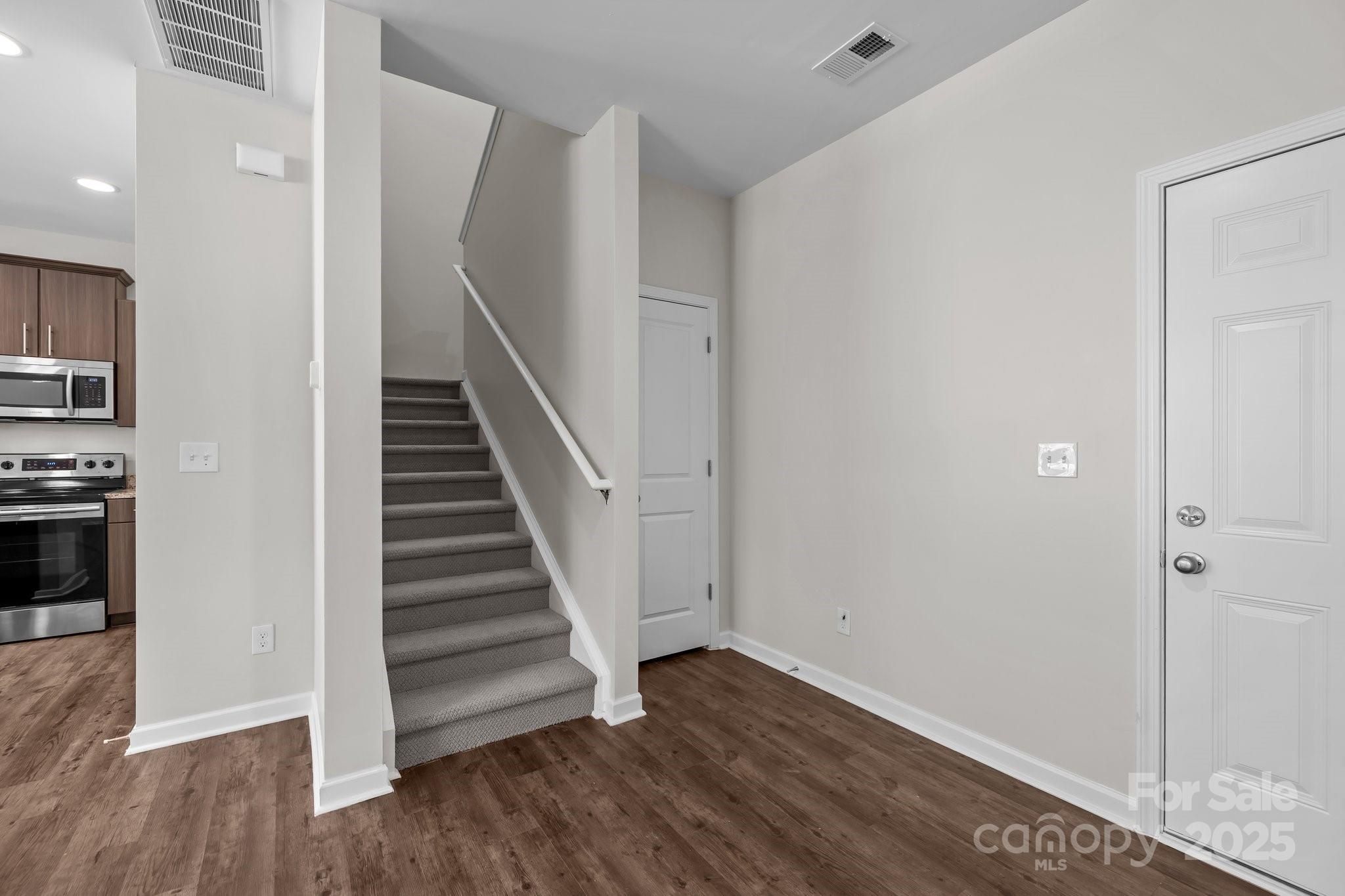 206 Overstone Court Fort Mill, SC 29715 - Photo 29 of 47 a view of a hallway with wooden floor and entryway