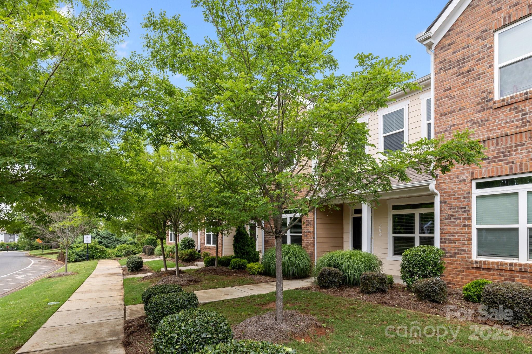 206 Overstone Court Fort Mill, SC 29715 - Photo 32 of 47 a front view of a house with garden