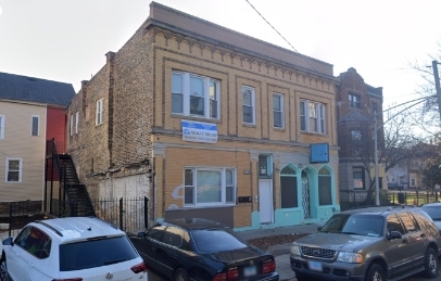 a front view of a house with parking space