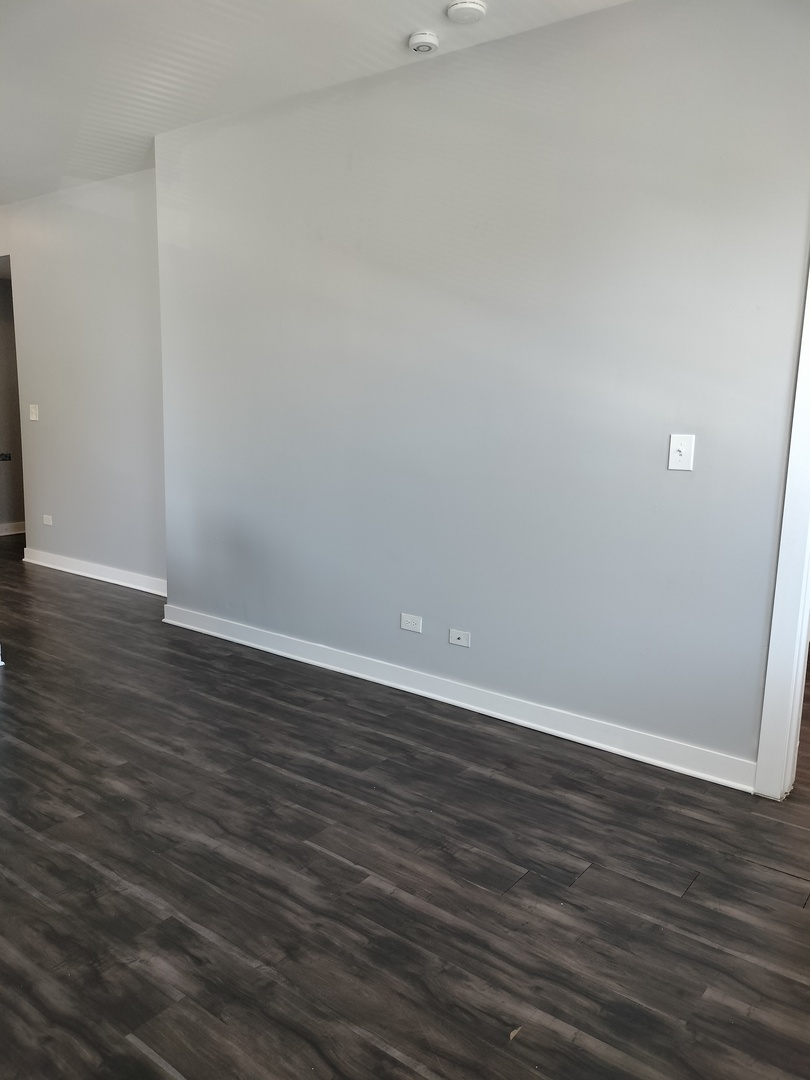 1943 West 48th Street, Unit 2 Chicago, IL 60609 - Photo 16 of 30 a view of an empty room with wooden floor