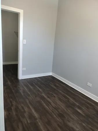 a view of wooden floor in an empty room