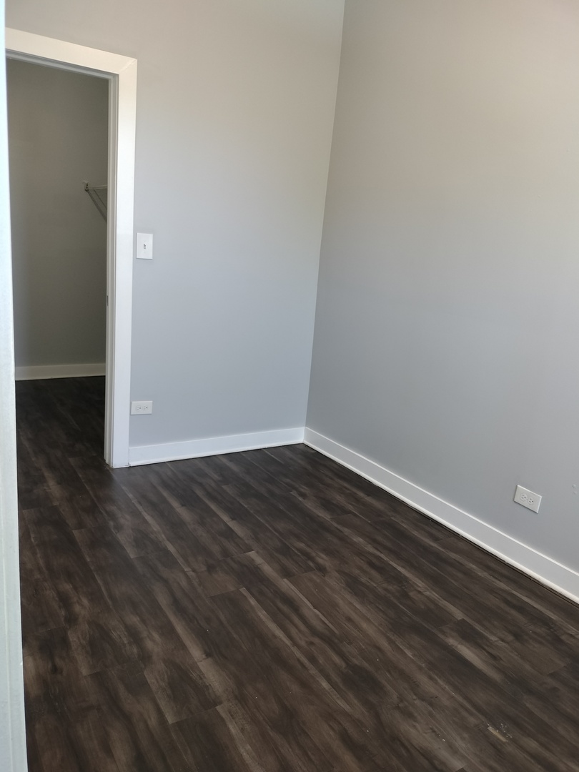 1943 West 48th Street, Unit 2 Chicago, IL 60609 - Photo 20 of 30 a view of wooden floor in an empty room