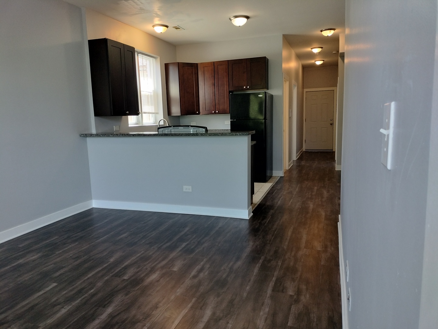1943 West 48th Street, Unit 2 Chicago, IL 60609 - Photo 25 of 30 a kitchen with stainless steel appliances granite countertop a refrigerator and a sink