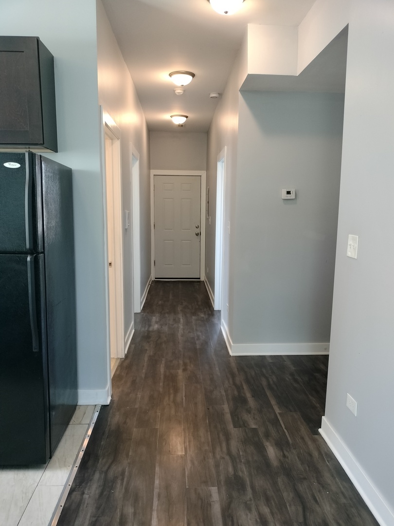 1943 West 48th Street, Unit 2 Chicago, IL 60609 - Photo 26 of 30 a view of hallway with wooden floor