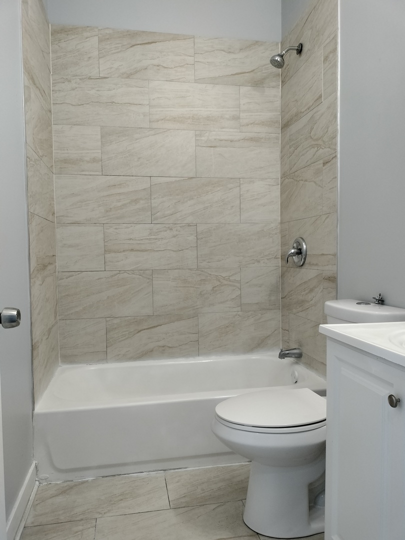 1943 West 48th Street, Unit 2 Chicago, IL 60609 - Photo 30 of 30 a bathroom with a toilet and a bathtub