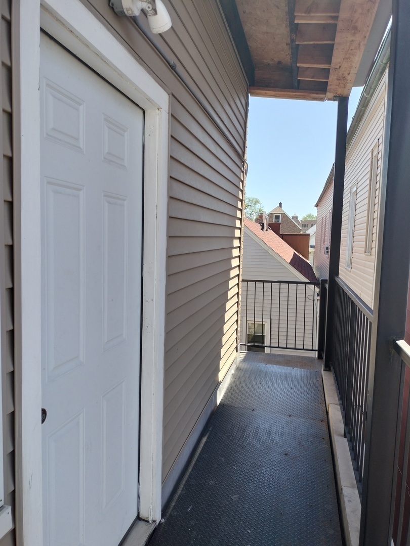 1943 West 48th Street, Unit 2 Chicago, IL 60609 - Photo 4 of 30 a view of a porch with a door