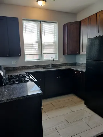a kitchen with a sink and a stove