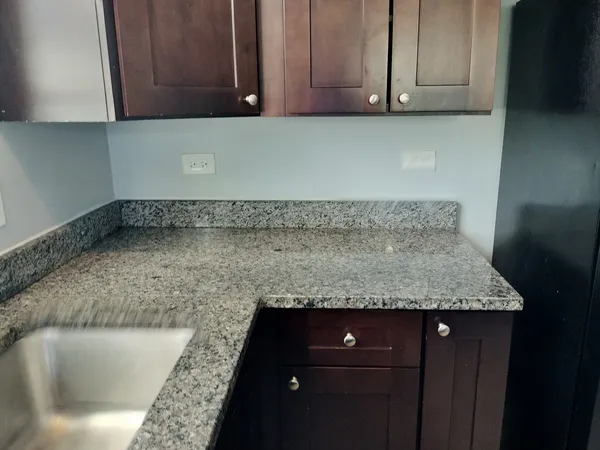 a kitchen with a sink and cabinets