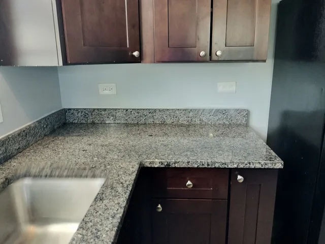 a kitchen with a sink and cabinets
