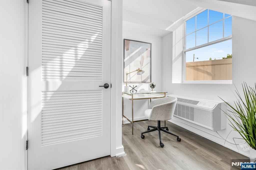 315 Railroad Avenue, Unit 108 East Rutherford, NJ 07073 - Photo 12 of 28 a view of a workspace with furniture and a window