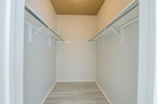 a view of an empty walk in closet